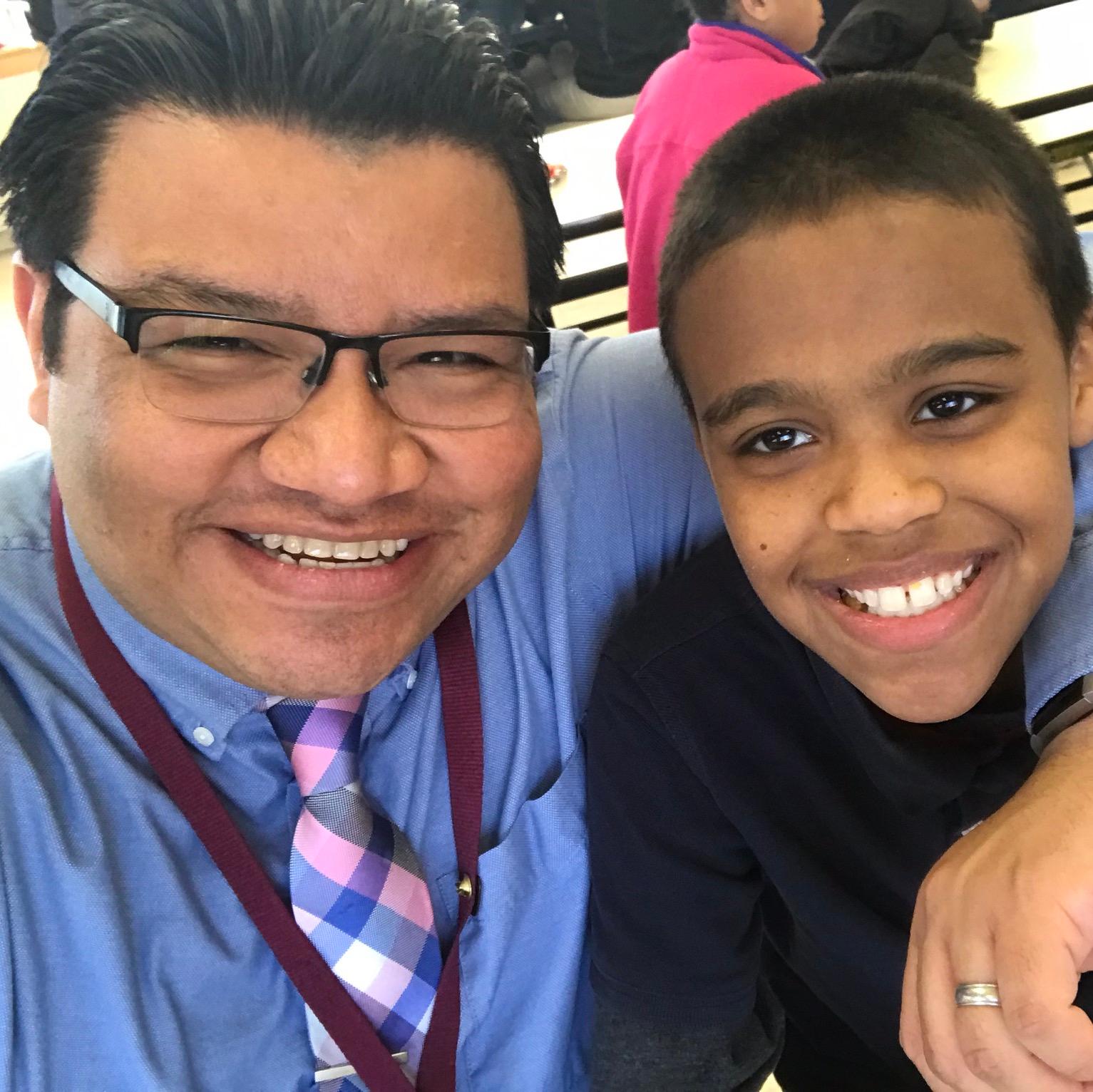 Manny Zaldivar with a student